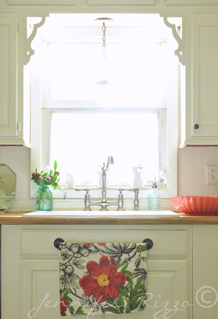 Cute Spring vignette over sink with towel