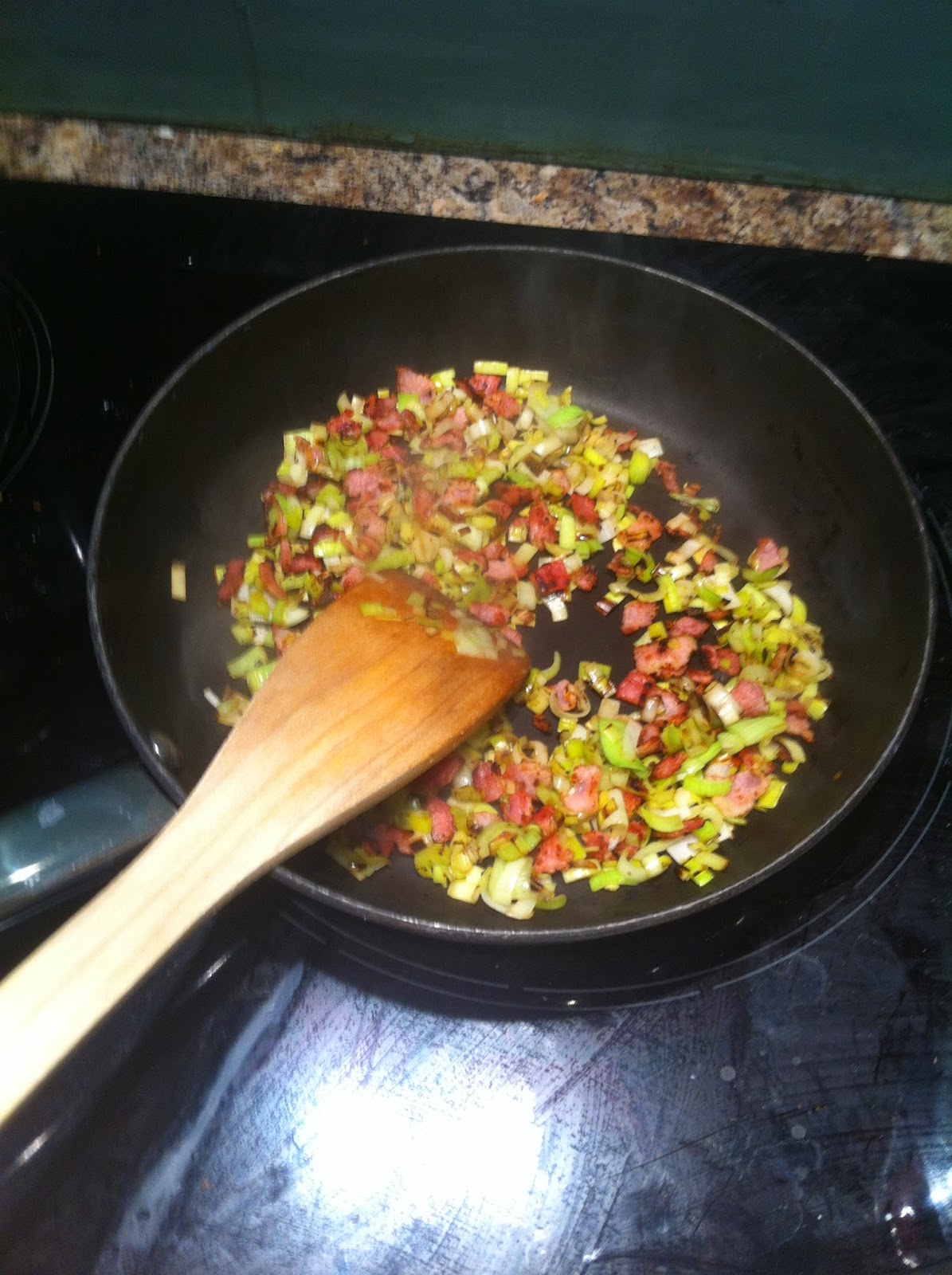 Frying leeks and bacon