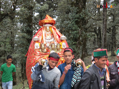 Group of devotees taking the idol to the temple Group of devotees taking the idol to the temple