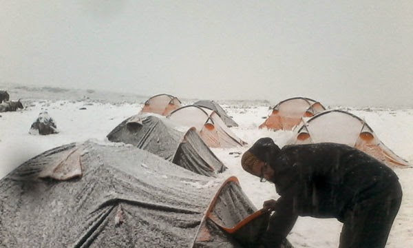 trekking tents frozen in himalayan mountains top Freezing cold frozen tents at Himalaya India