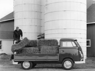 A truck loaded with bales of hay