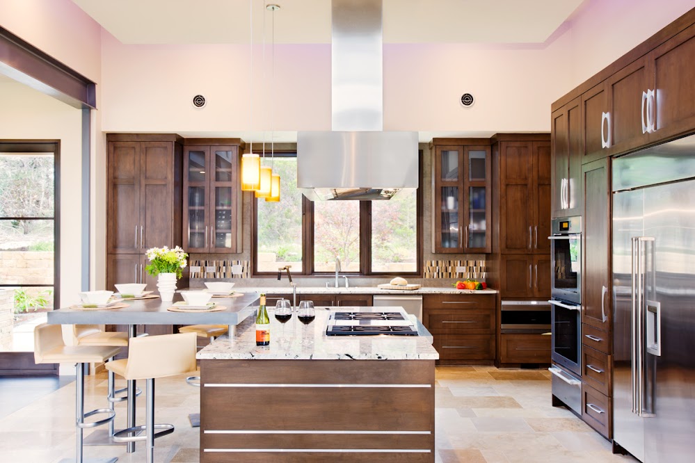 Photo of modern kitchen interiors with the furniture made of dark brown wood