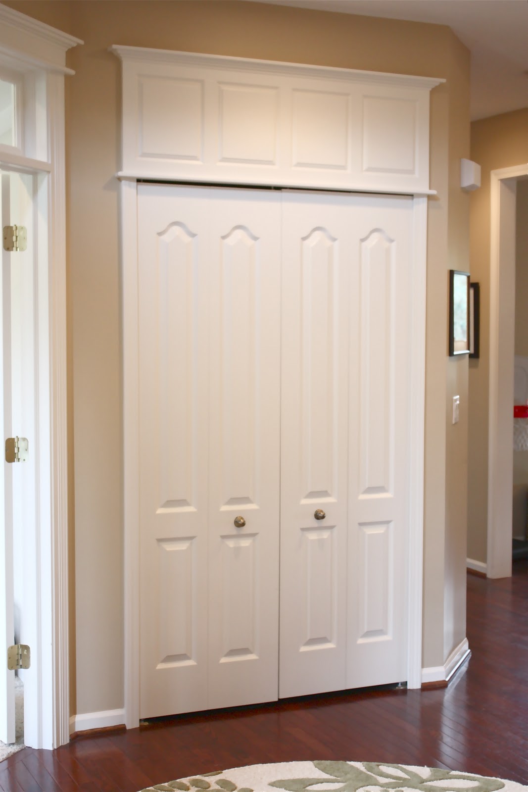 Position the door in the doorway of the structure and make sure it can swing freely open and closed. Use shims to support it at the correct height while fastening the hinges and latch to the building.
