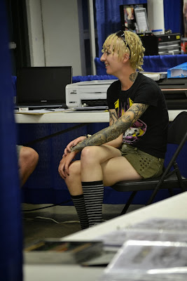 photo by Tom Storm - Raivyn dK - Easyriders Rodeo 2013 Chillicothe OH - tattoos - Fuxleep t-shirt, Decree shorts, Hot Topic socks, Converse sneakers