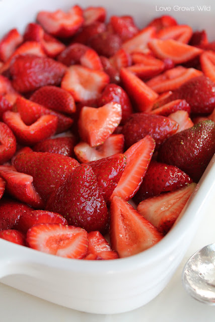 LoveGrowsWild.com | Add this delicious homemade Roasted Strawberry Topping to your ice cream, waffles, or yogurt! Perfect for catching overripe berries just in time!