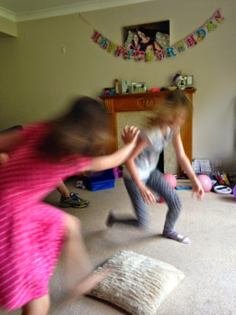 Playing musical cushions; the girls moving super fast! Playing musical cushions; the girls moving super fast!