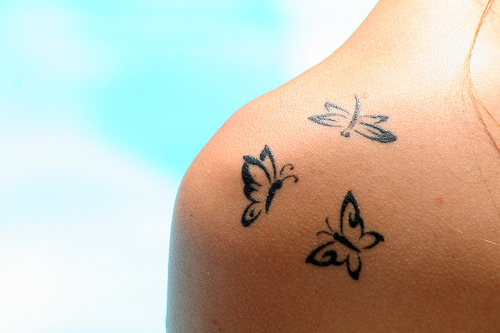 tattoos for girls on shoulders and back. Butterflies girls tattoos on shoulder