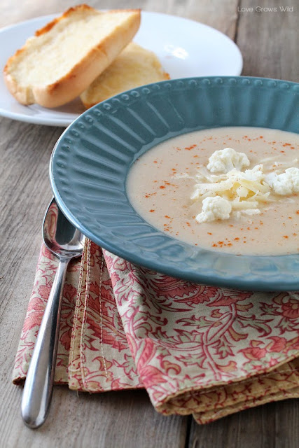 This Cheesy Cauliflower Soup is so creamy and delicious and good for you too! You won't believe how tasty this simple soup is! LoveGrowsWild.com