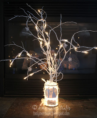 For my winter wedding decorations I created a lighted branch centerpiece