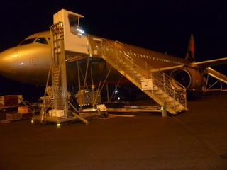 Hobart airport tarmac with plane and lift to the cabin