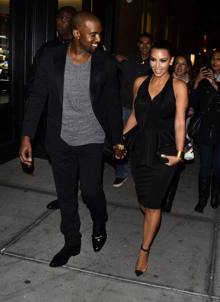 Kanye west and kim kardashian holding hands
