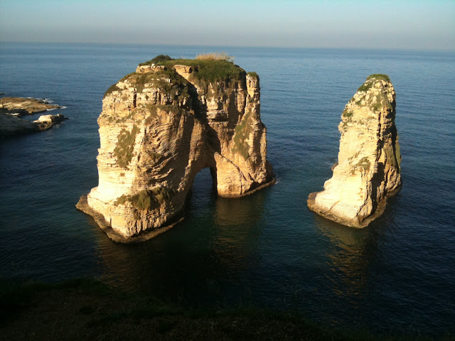 a large rock formation in the water