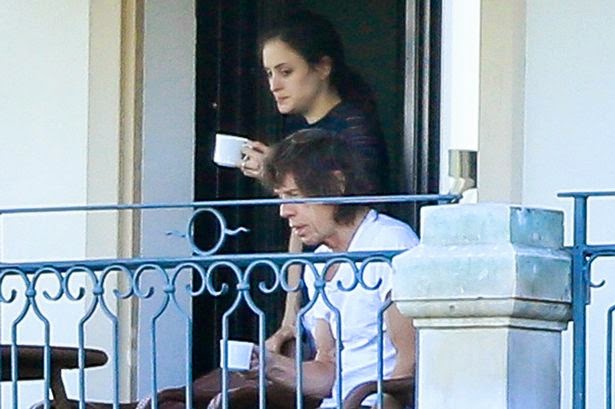 Mick Jagger seduced to a young mystery brunette at the hotel in Switzerland The 70-year-old, Mick Jagger seemed pleased to his music salary as he was snapped hanging out with a young mystery brunette at the hotel in Zurich, Switzerland on Saturday, June 7, 2014.