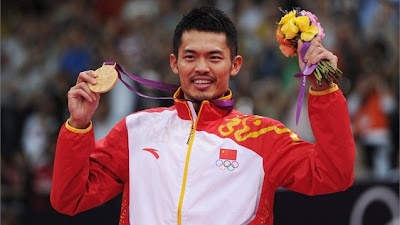 Lin Dan of China celebrates with his Gold medal