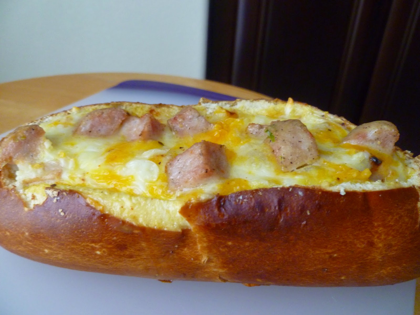 The Pastry Chef's Baking Sausage, Egg, and Cheese Pretzel Bread Boat