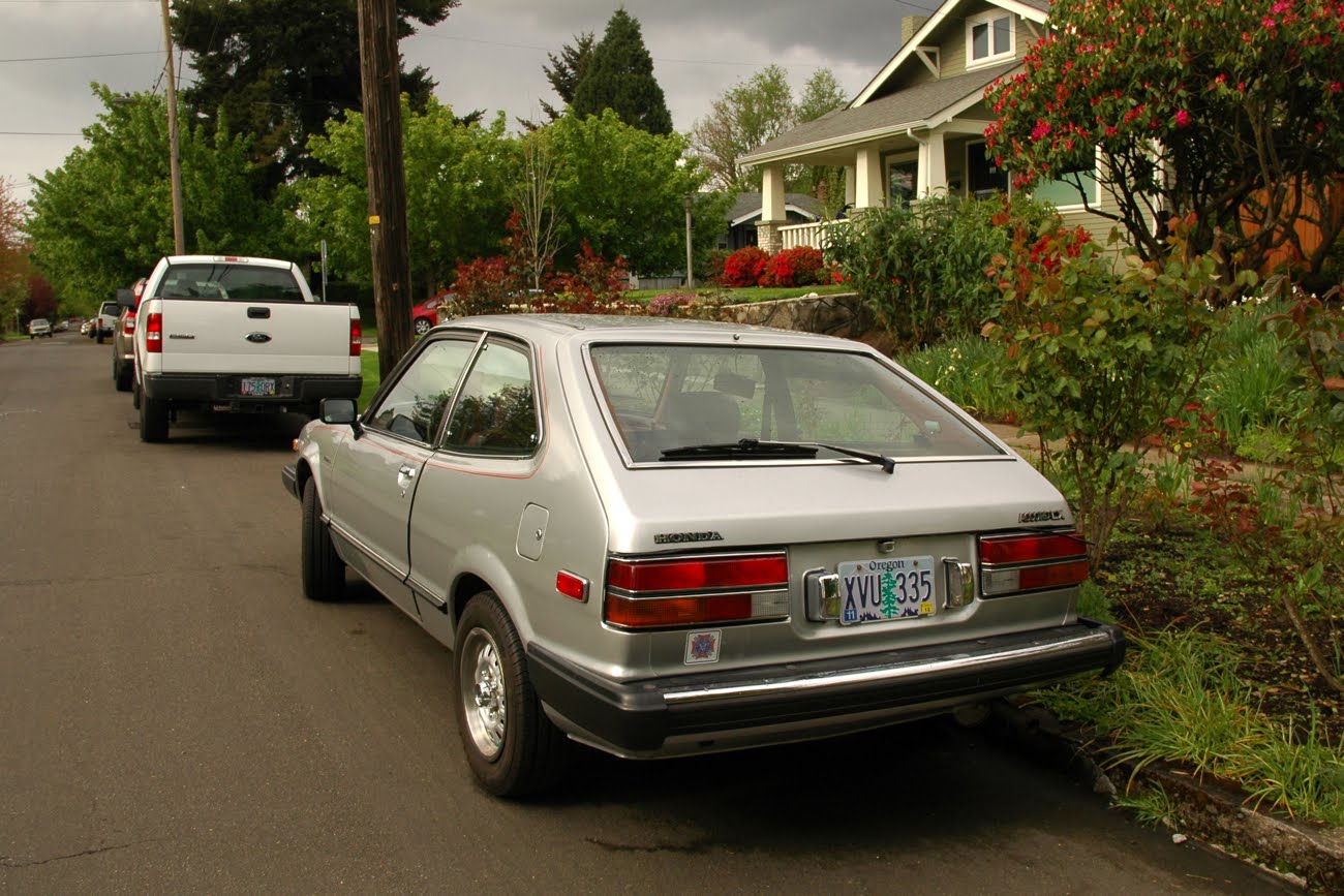 OLD PARKED CARS. 2 Silver Beans on 1 Block 1981 Honda