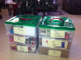 Christmas ornaments organized by theme in layers in plastic Snapware Stack-N-Store ornament container boxes