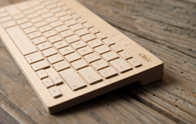 close up of maple wooden keyboard on wooden table