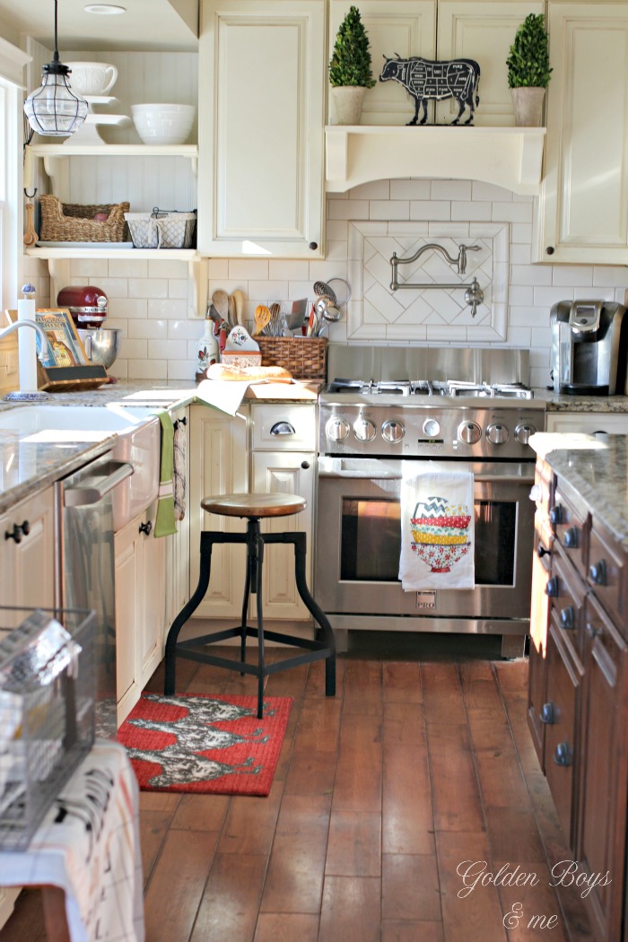 Farmhouse style kitchen with DIY mantel hood over range - www.goldenboysandme.com