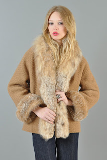 Vintage 1960's camel colored wool coat with lynx fur collar and cuffs.