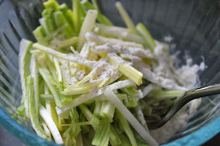 Tossing sliced leeks with flour