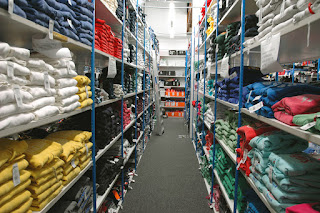 Steel shelving with folded garments