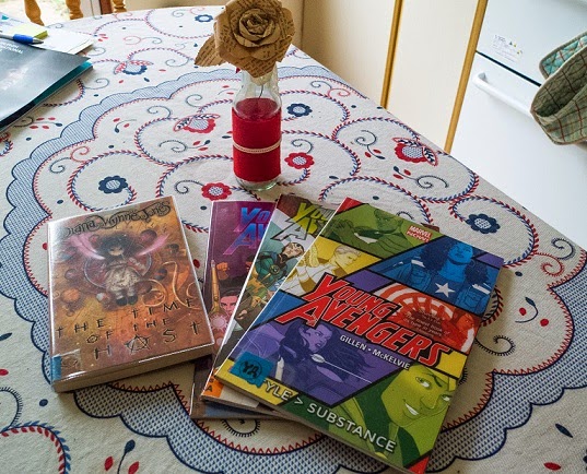 Copies of the Young Avengers and of The Time of the Ghost by Diana Wynne Jones on my kitchen table