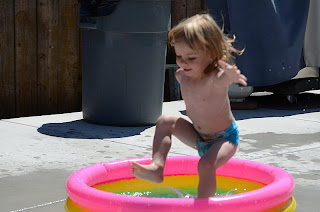 Little girl in a kiddie pool