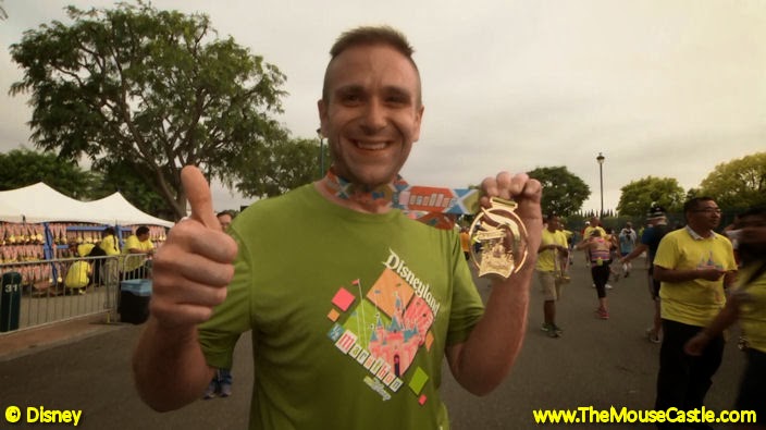 Derrick Deaton shows off his Disneyland Half Marathon medal.