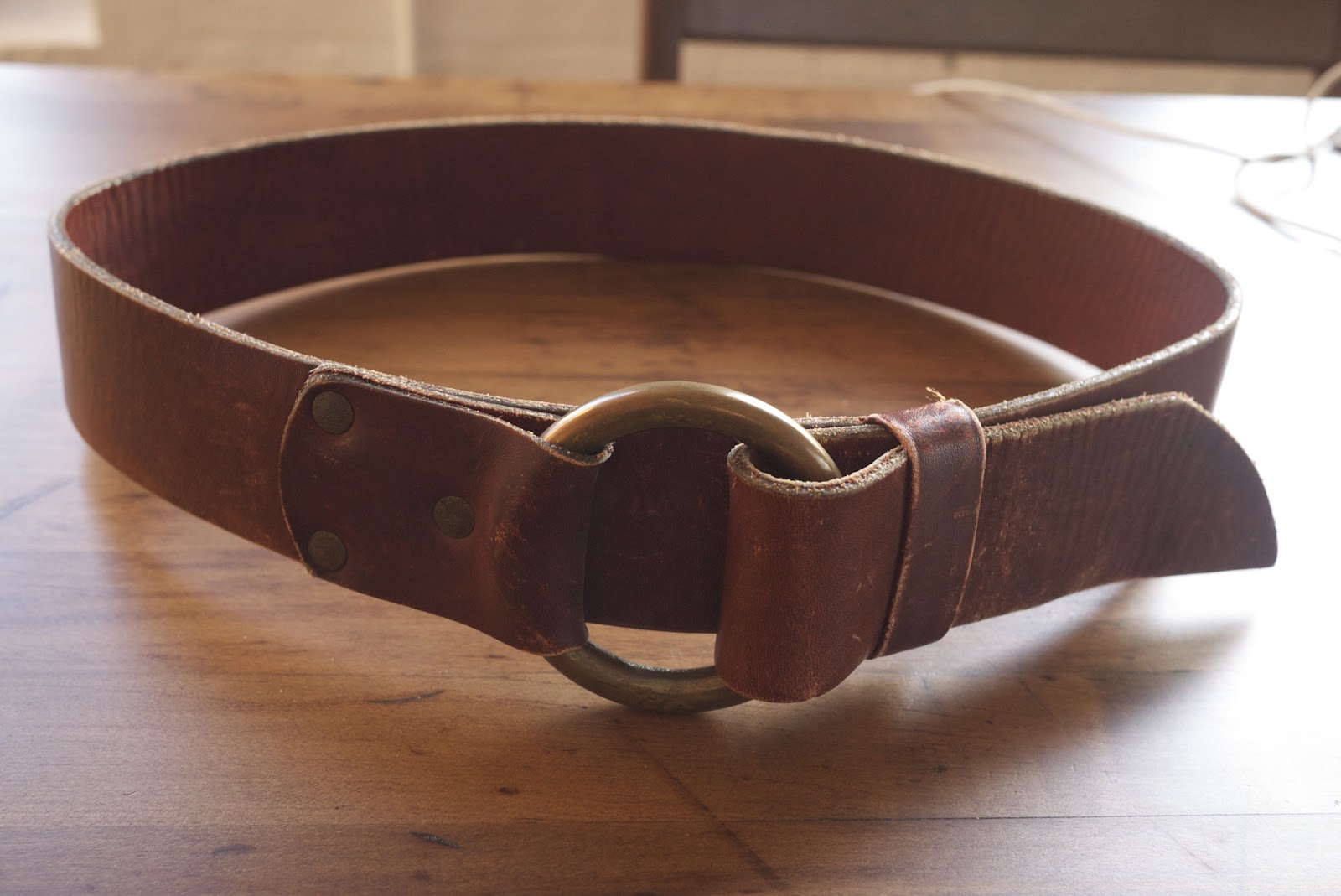 laws of general economy Vintage leather brass belt