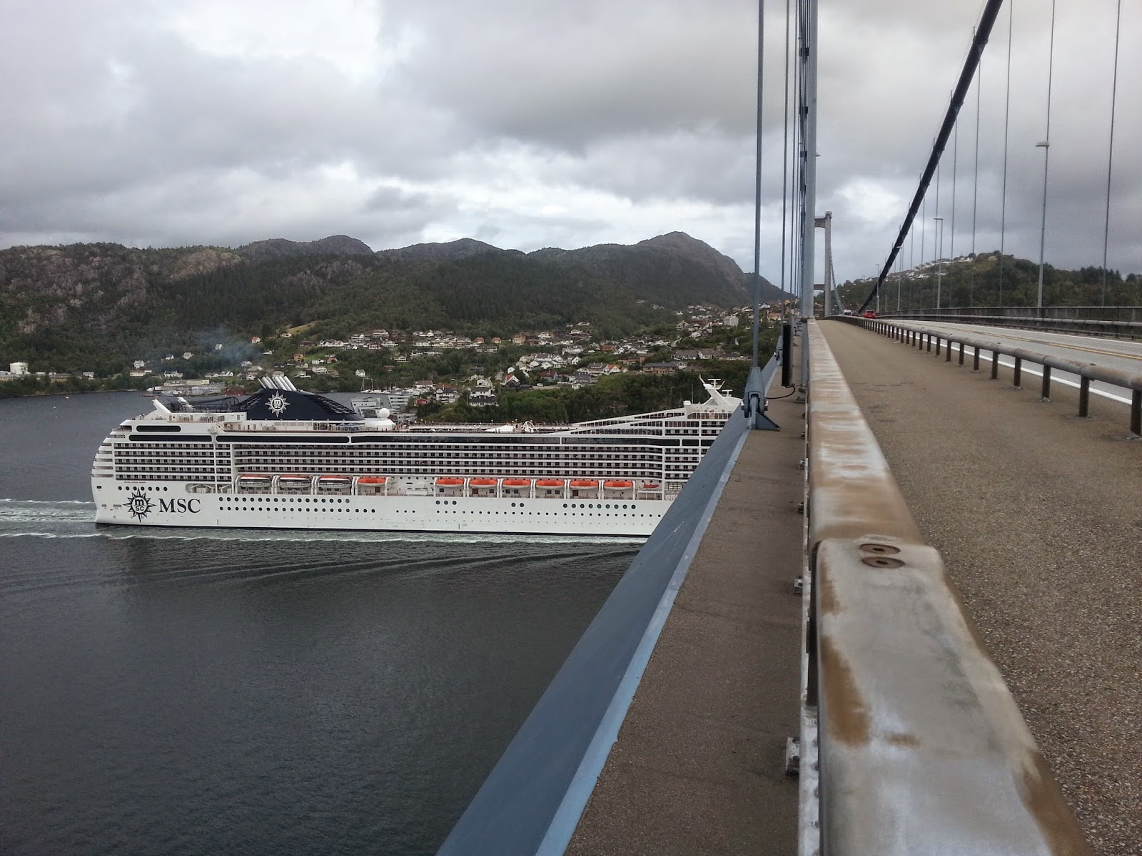 Cruise Ship MSC Poesia passes under the Askøy Bridge, Bergen Cruise Ship MSC Poesia passes under the Askøy Bridge, Bergen