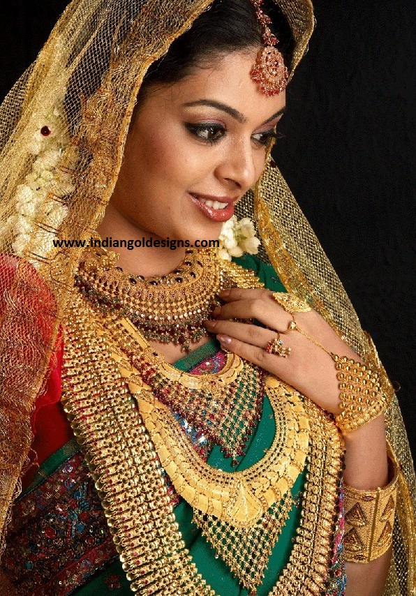 Gold and Diamond jewellery designs Model in heavy gold bridal indian