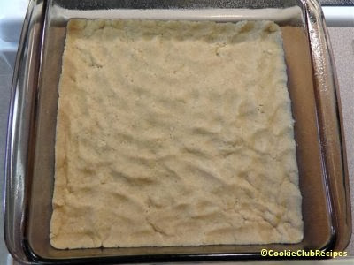 cookie dough base pressed in baking pan