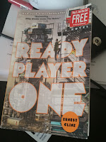 Ready Player One Cover Ready Player One by Ernest Cline on a desk.