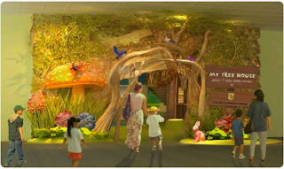 Image is property of http://www.eco-business.com/press-releases/my-tree-house-world’s-1st-green-library-for-kids/ library entrance with sign stating My Tree House
