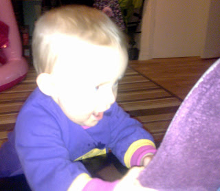 cheeky baby argues with a slipper