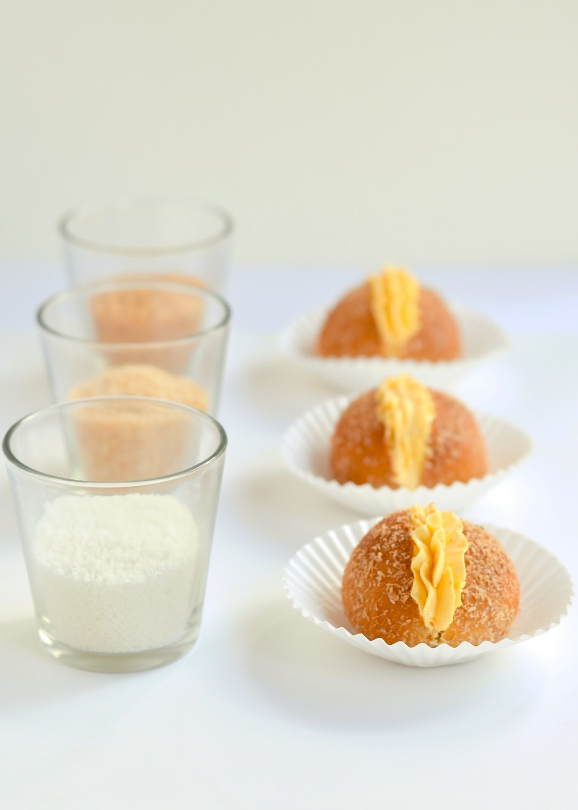 Mini Coconut cream buns evoking comfort for a weary family. The moonblush Baker