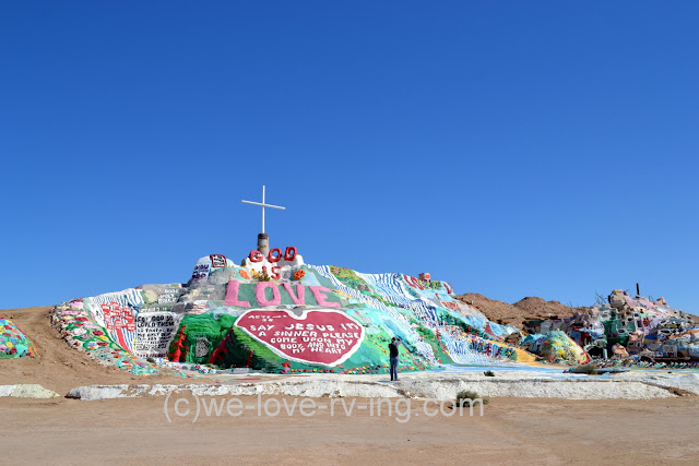 There are messages painted on the side of Salvation Mountain