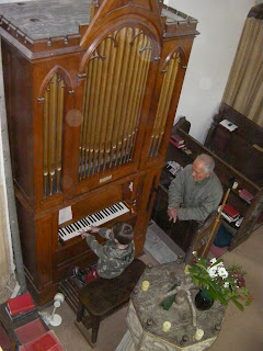 boy playing church organ