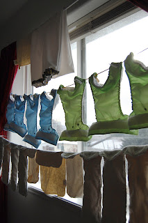 cloth diapers line drying in window