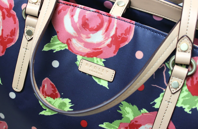 Radley Autumn Rose Radley Autumn Rose teaming blooming autumnal roses with deep royal blue