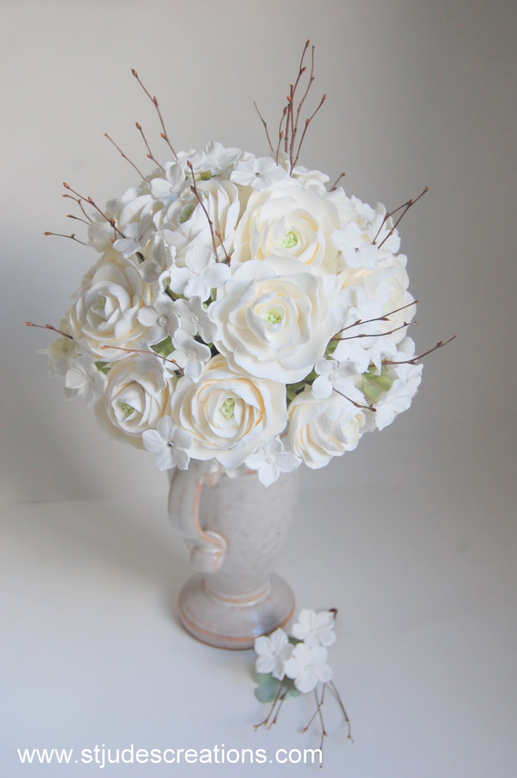 Winter wedding bouquet with twigs in clay ranunculus,hydrangea