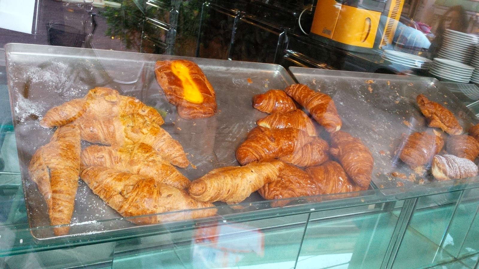 Brioches on metal trays in a snack bar in Vicenza