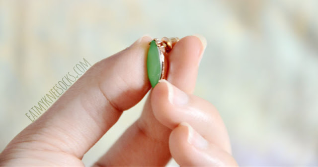 Bezel Box Mini Review: Jewelry Subscription Box - Armada Pastel Earrings Close-up of the green-and-gold detailing on the Armada Pastel earrings from the Bezel Box Mini.