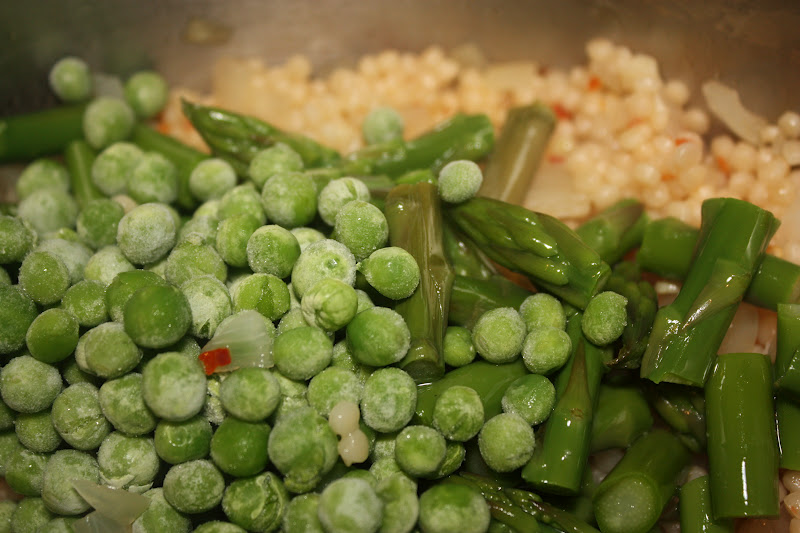 Once seven minutes have passed, remove the cover and add the asparagus