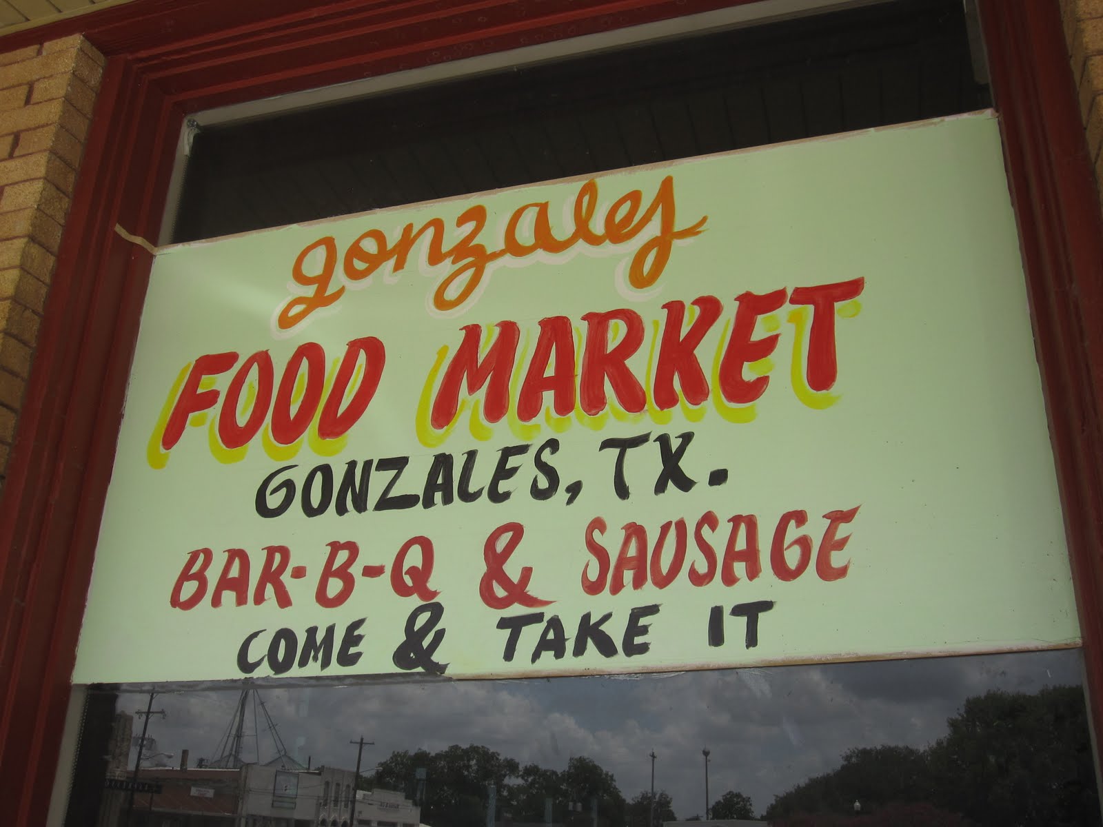 Man Up Tales of Texas BBQ™ Signs at Gonzales Food Market (Gonzales, TX)