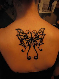 Upper back butterfly female tattoos