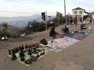 Souvenir sellers outside ANGH'S palace in Longwa.