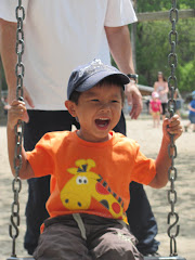 Alexandre having fun on the swing