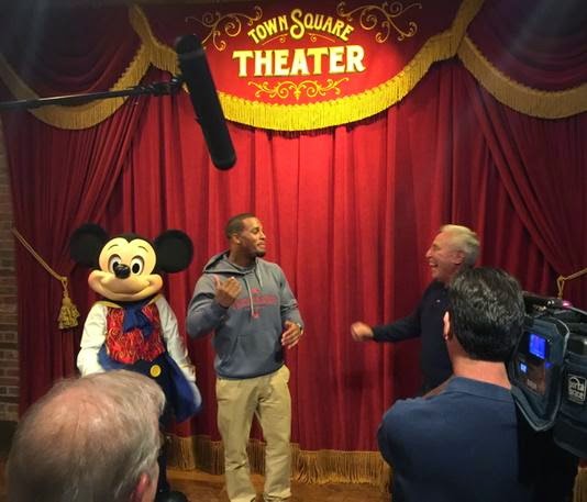 Lee Corso meets Mickey Mouse. Lee Corso meets Mickey Mouse.